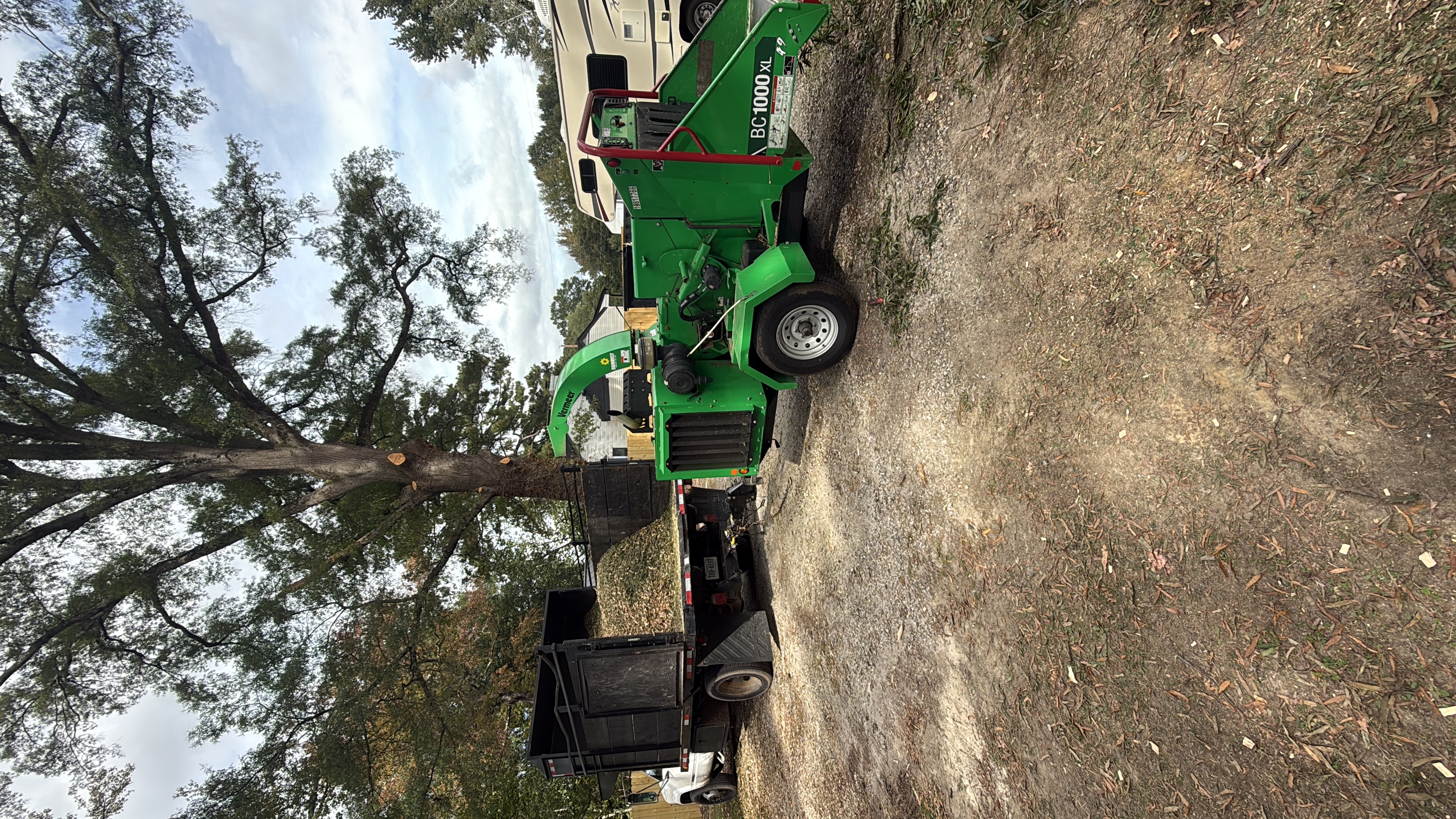 Wood chipper and equipment for land clearing services in Henrico